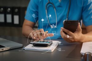 Doctor with stethoscope calculating medical fees and revenue at clinic using a calculator.