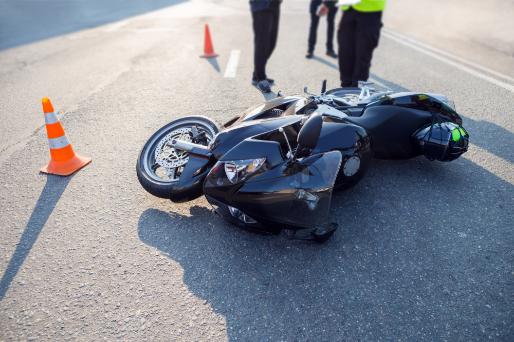 Damaged motorcycle at the accident scene on the road