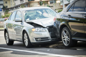 A rear-end collision occurs when one vehicle crashes into the back of another, often due to sudden braking or tailgating.