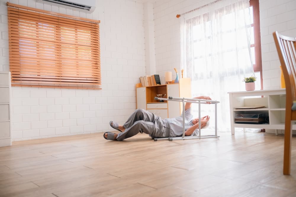 An elderly man has fallen on the floor in a nursing home.