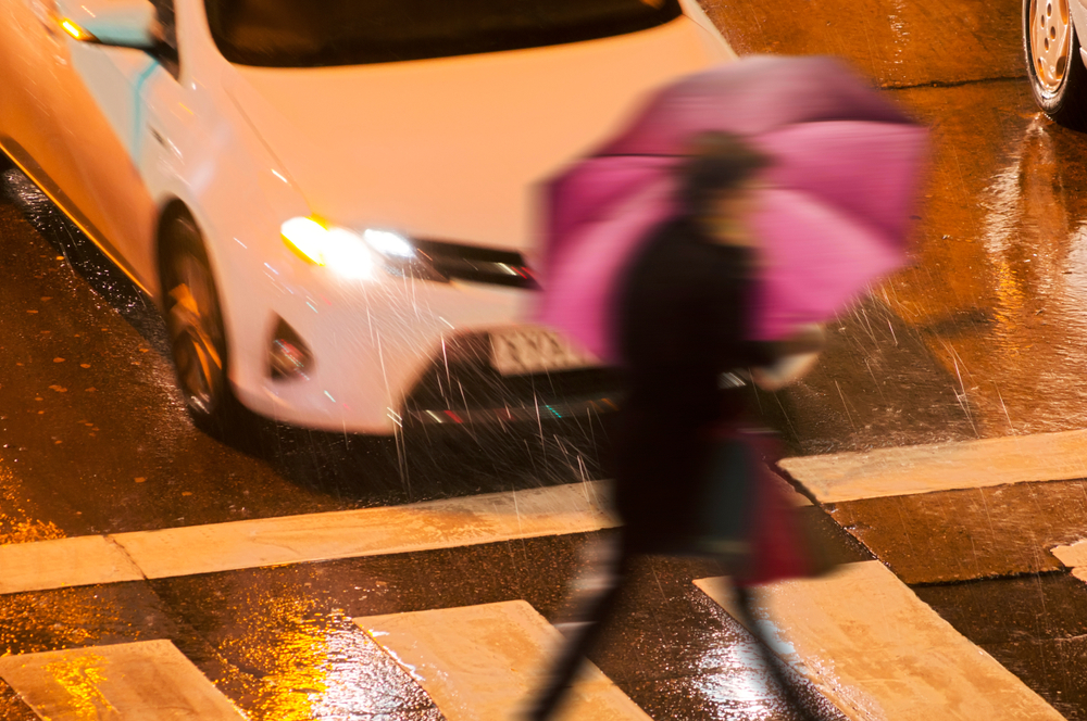 people pedestrian in dangerous situation in crosswalk in city street at night